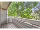 Outdoor balcony offers a private space to enjoy views of the surrounding lush green trees at 8795 W Cornell Ave # 1, Lakewood, CO 80227