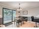 Bright dining space with a sliding glass door and modern furniture at 8795 W Cornell Ave # 1, Lakewood, CO 80227