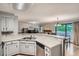 Open concept, showcasing the kitchen, living room, and dining area at 8795 W Cornell Ave # 1, Lakewood, CO 80227
