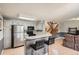 Kitchen and living room, featuring a bar and stainless steel appliances at 8795 W Cornell Ave # 1, Lakewood, CO 80227
