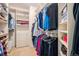 Walk-in closet offers ample storage with custom shelving and hanging space at 4875 S Monaco St # 105, Denver, CO 80237