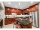 This gourmet kitchen boasts custom cabinetry, stainless steel appliances, and a center island at 4875 S Monaco St # 105, Denver, CO 80237