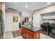 This gourmet kitchen boasts custom cabinetry, stainless steel appliances, and a center island at 4875 S Monaco St # 105, Denver, CO 80237