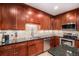 This gourmet kitchen boasts custom cabinetry, stainless steel appliances, and a center island at 4875 S Monaco St # 105, Denver, CO 80237