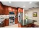 This gourmet kitchen boasts custom cabinetry, stainless steel appliances, and a center island at 4875 S Monaco St # 105, Denver, CO 80237