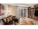 Comfortable living room featuring plush leather seating and access to the patio at 4875 S Monaco St # 105, Denver, CO 80237