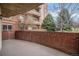 Enjoy a private brick patio with views of lush landscaping and beautiful building architecture at 4875 S Monaco St # 105, Denver, CO 80237