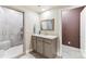 Bathroom with a walk-in shower, granite countertop vanity and neutral color palette at 8099 Arapahoe Peak St, Littleton, CO 80125