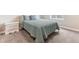 Cozy bedroom with neutral tones, carpet and a comfortable full-size bed with blue comforter at 8099 Arapahoe Peak St, Littleton, CO 80125