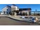 The community clubhouse features modern farmhouse design with a stone entryway at 8099 Arapahoe Peak St, Littleton, CO 80125