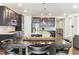Gourmet kitchen with an expansive island, stainless steel appliances, and barstool seating at 8099 Arapahoe Peak St, Littleton, CO 80125