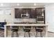 Beautiful kitchen island with granite countertops and pendant lighting at 8099 Arapahoe Peak St, Littleton, CO 80125