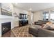 Inviting living room featuring a modern fireplace and comfortable seating at 8099 Arapahoe Peak St, Littleton, CO 80125