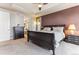 This main bedroom features a tray ceiling, ceiling fan, and ensuite bathroom at 8099 Arapahoe Peak St, Littleton, CO 80125