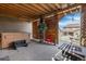 Inviting outdoor space featuring a hot tub, rustic wood paneling, and comfortable seating around a fire table at 8099 Arapahoe Peak St, Littleton, CO 80125