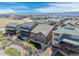 Stunning aerial view of home featuring a well-manicured backyard and mountain views at 8099 Arapahoe Peak St, Littleton, CO 80125