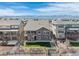 Beautiful backyard complete with stone detailing and well-manicured lawn overlooking mountain views at 8099 Arapahoe Peak St, Littleton, CO 80125
