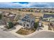 Beautiful aerial shot of a two-story home with lush landscaping and a spacious driveway on a cul-de-sac at 10551 Redcone Way, Highlands Ranch, CO 80130