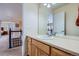 Well-maintained bathroom featuring a spacious vanity, a large mirror, and neutral tones for a serene atmosphere at 10551 Redcone Way, Highlands Ranch, CO 80130