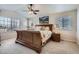 Bedroom with ceiling fan, floral bedding and picture window at 10551 Redcone Way, Highlands Ranch, CO 80130