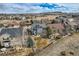 Aerial view of neighborhood showcasing a two-story home with well-maintained lawn and charming outdoor space at 10551 Redcone Way, Highlands Ranch, CO 80130