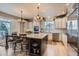 Spacious kitchen featuring a large island, stainless steel appliances, and custom cabinets at 10551 Redcone Way, Highlands Ranch, CO 80130