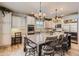 Bright kitchen boasting a center island with seating, sleek countertops, and plenty of storage at 10551 Redcone Way, Highlands Ranch, CO 80130