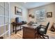 Office space with wooden desk, chair, and natural light from window and door at 10551 Redcone Way, Highlands Ranch, CO 80130