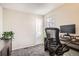 Bright bedroom featuring neutral walls, plush carpeting, and a modern workstation setup at 2650 Perry St, Denver, CO 80212