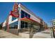 Modern building with an Alamo Drafthouse Cinema sign and an outdoor patio at 2650 Perry St, Denver, CO 80212