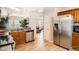 Well-equipped kitchen with wood cabinets, stainless steel appliances, and an open layout at 2650 Perry St, Denver, CO 80212