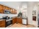 Modern kitchen equipped with stainless steel appliances, ample counter space, and stylish cabinetry at 2650 Perry St, Denver, CO 80212