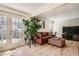 Cozy living room with sliding door access to the backyard, featuring a comfortable seating area at 2650 Perry St, Denver, CO 80212