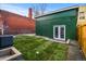 Landscaped backyard with detached garage at 2521 Champa St, Denver, CO 80205