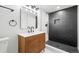 Modern basement bathroom with walk-in shower at 2521 Champa St, Denver, CO 80205