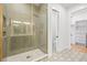 Spa-like bathroom with a large glass shower, patterned tile floor, and walk-in closet at 2521 Champa St, Denver, CO 80205