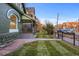 Landscaped front yard with a walkway and fence at 2521 Champa St, Denver, CO 80205