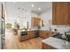 Modern kitchen with light wood cabinets, quartz countertops, and stainless steel appliances at 2521 Champa St, Denver, CO 80205