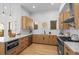 Modern kitchen with light wood cabinets, quartz countertops, and stainless steel appliances at 2521 Champa St, Denver, CO 80205