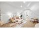 Cozy living area with a neutral sofa, ottomans, and natural light at 2521 Champa St, Denver, CO 80205