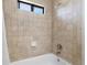 Tiled bathroom with a shower and bath at 12662 E Warren Dr # F, Aurora, CO 80014