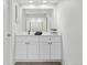 Bathroom with white cabinets, a black faucet, and a decorative plant at 12662 E Warren Dr # F, Aurora, CO 80014