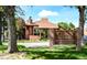 Community clubhouse and pool entrance with brick sign and well maintained grounds at 12662 E Warren Dr # F, Aurora, CO 80014