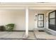 Inviting front entrance with a secure black security screen door and tidy landscaping at 12662 E Warren Dr # F, Aurora, CO 80014