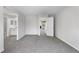 Open floor plan with light gray carpet with views of the bathroom and other rooms at 12662 E Warren Dr # F, Aurora, CO 80014