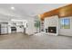 Open concept living room showcasing the kitchen, a fireplace, and a sliding glass door at 12662 E Warren Dr # F, Aurora, CO 80014