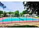 Community tennis courts surrounded by green trees and neighborhood townhomes at 12662 E Warren Dr # F, Aurora, CO 80014