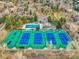 Aerial shot highlighting the community amenities, featuring tennis courts and a pool at 8166 E Phillips Ave, Centennial, CO 80112