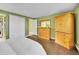 Bedroom featuring light green walls, wood floors and closet at 8166 E Phillips Ave, Centennial, CO 80112