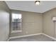 Simple bedroom with neutral-colored carpet and a view of a window at 8166 E Phillips Ave, Centennial, CO 80112